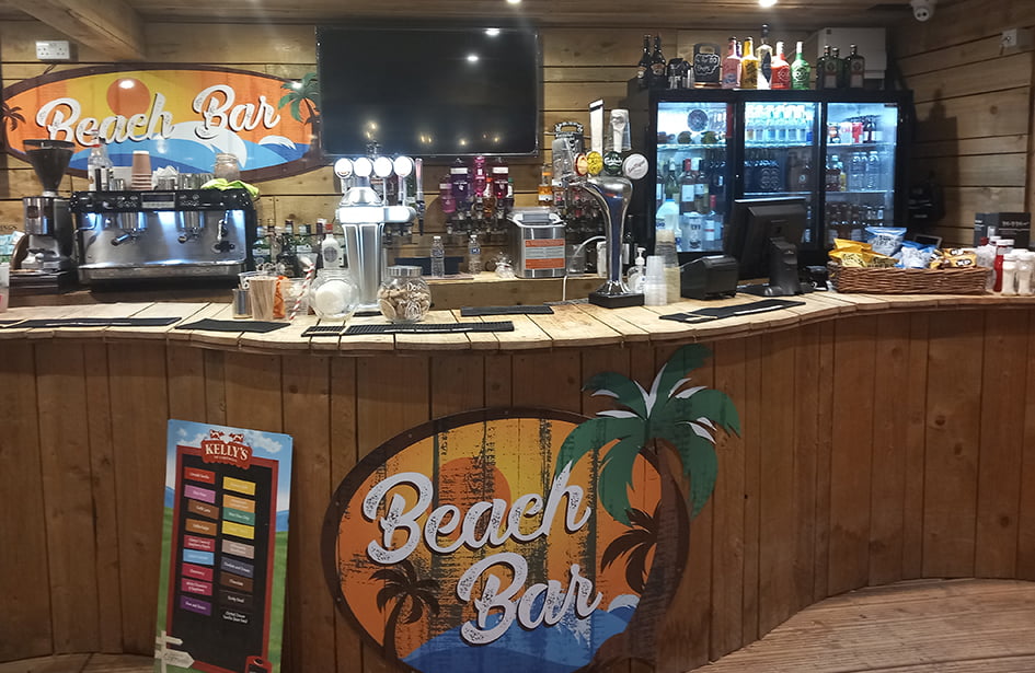 A bar with a sign that says beach bo.