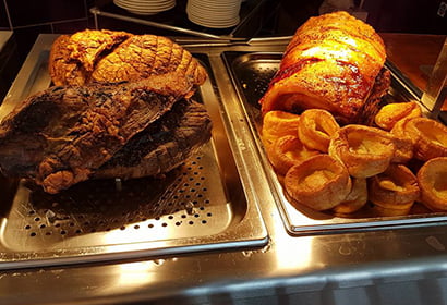 A tray of meat on a table.