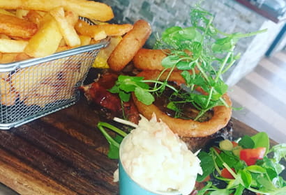 A plate with a steak and fries on it.